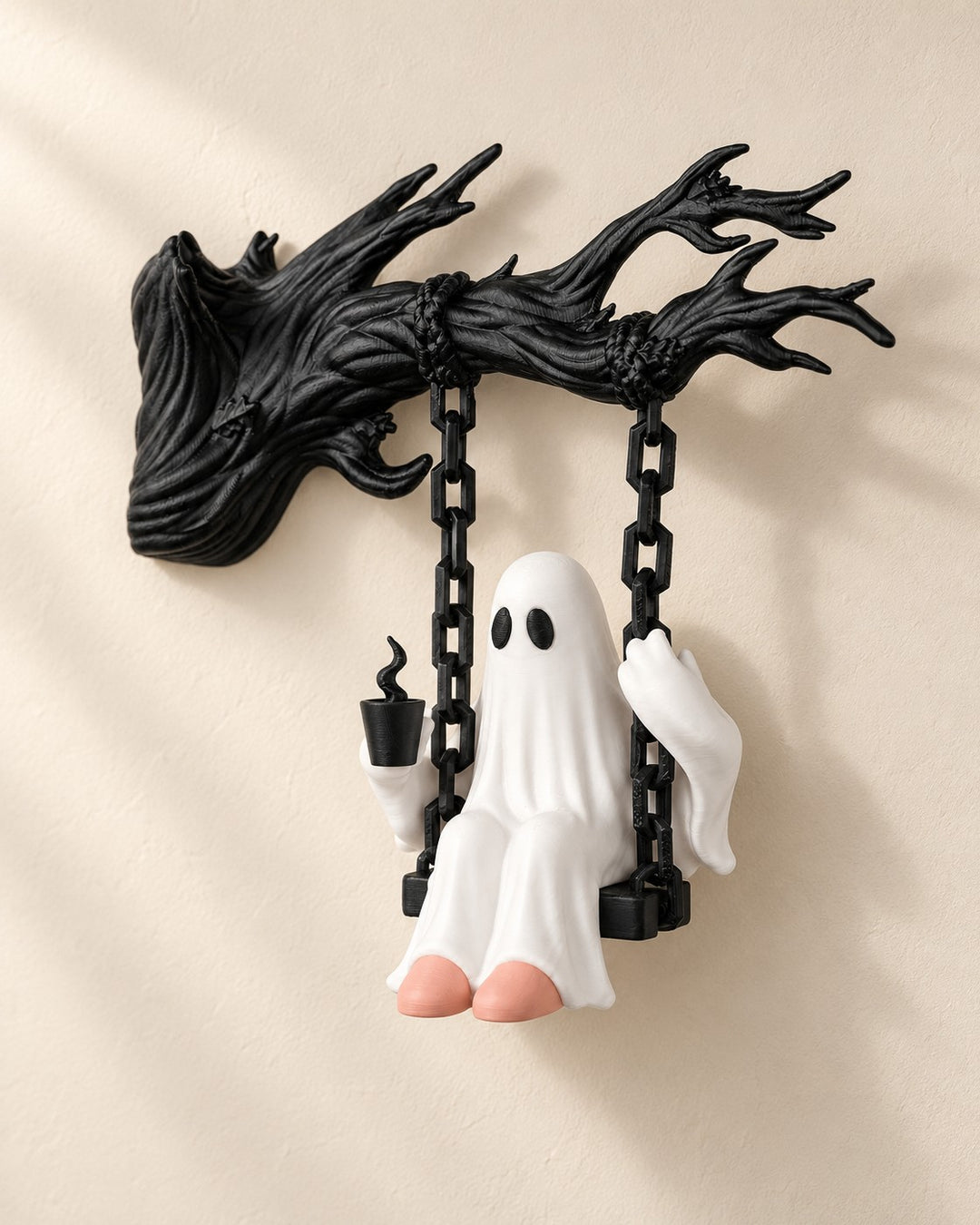 Ghost on a Swing: A Halloween wall sculpture: a small white ghost swinging from a haunted branch