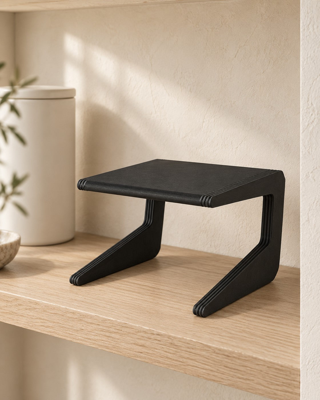 Narrow Shelf Riser in a calm, softly lit interior, shown at true scale