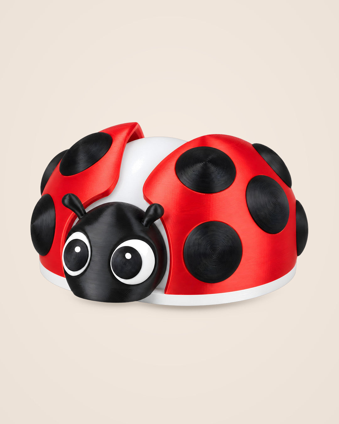 Ladybird Lamp: Spotted red table lamp with a warm USB glow between the wings