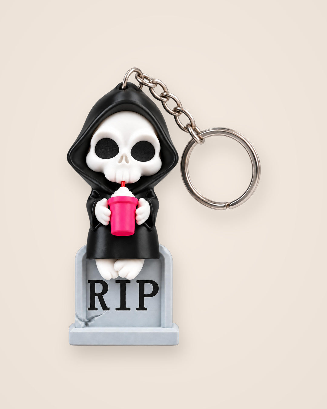 Sweet Rest Reaper Keyring: A cute hooded reaper with a pink milkshake, perched on a RIP tombstone