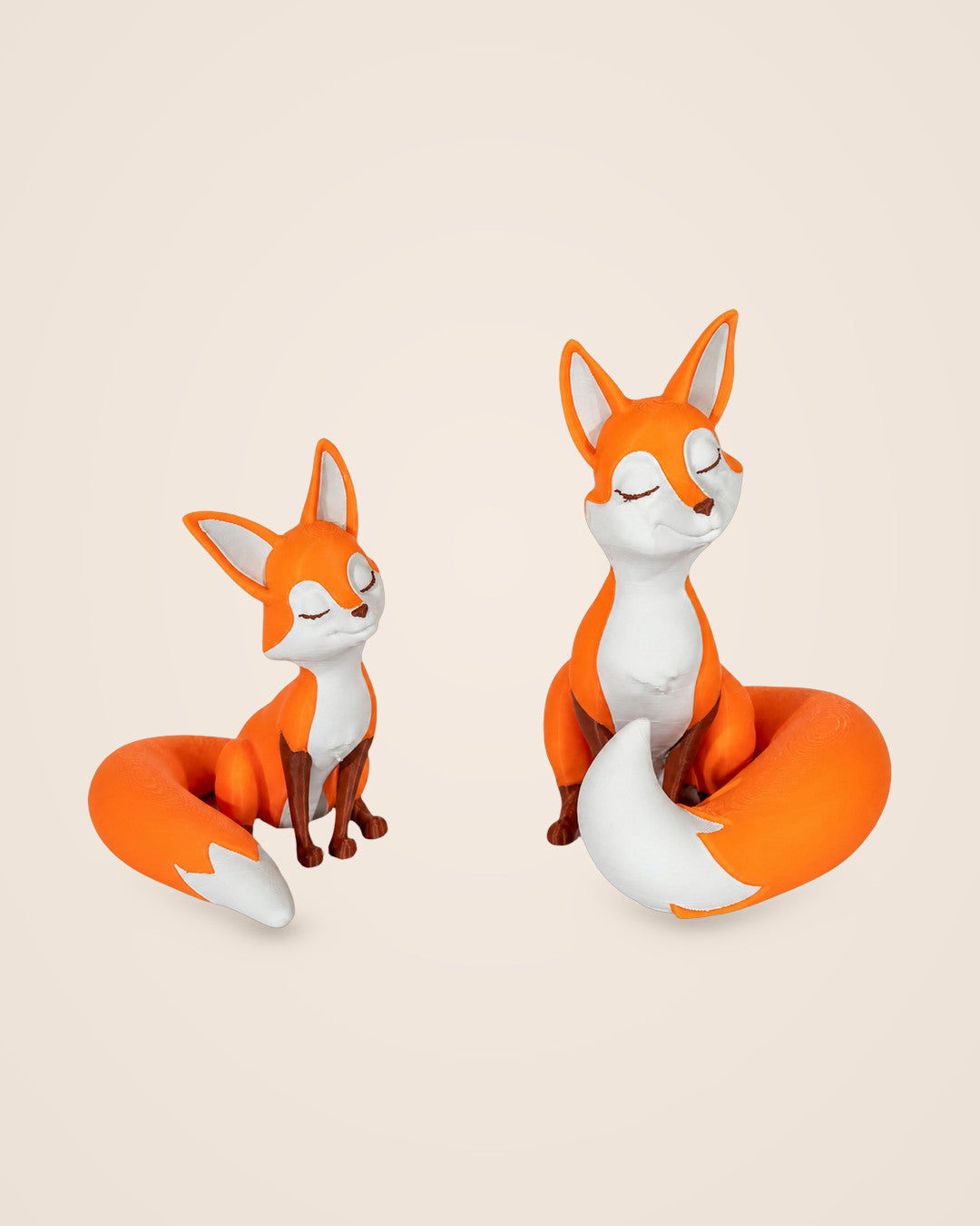Fox Bookends: A set of two foxes with curled tails, one large and one small