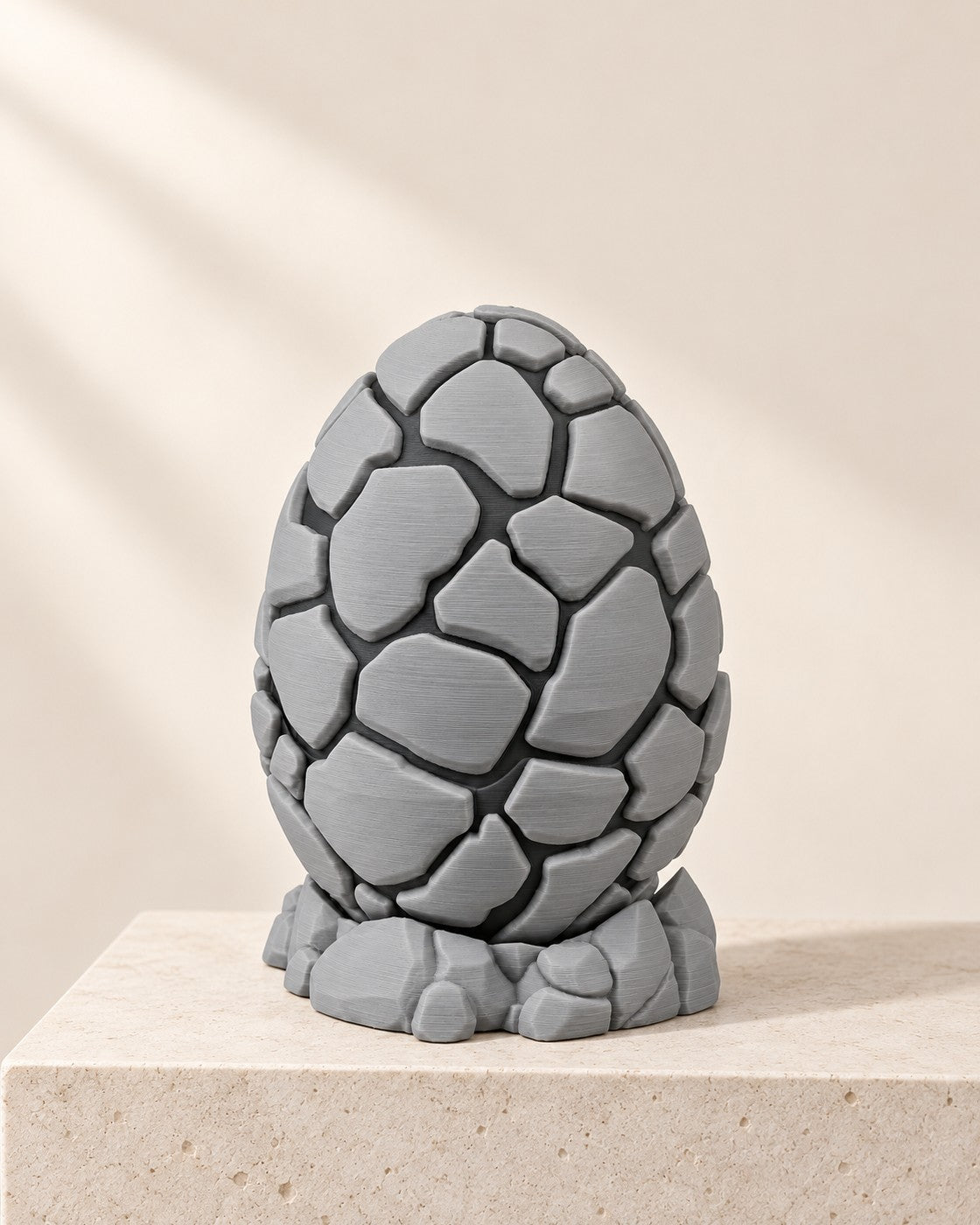 Stone Dragon Egg on a pale limestone plinth, soft studio light