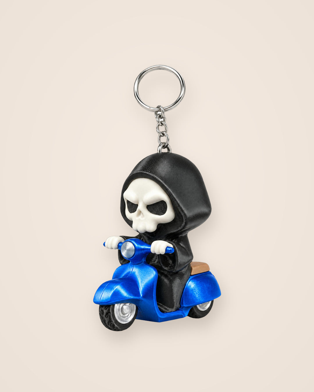 Grim Rider Keyring: A hooded reaper on a blue retro scooter, with ring and chain