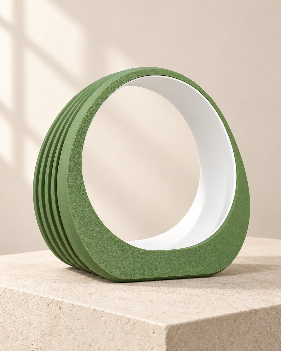 Ring Headphone Stand: Sculptural olive green ring with a white liner, for over-ear headphones