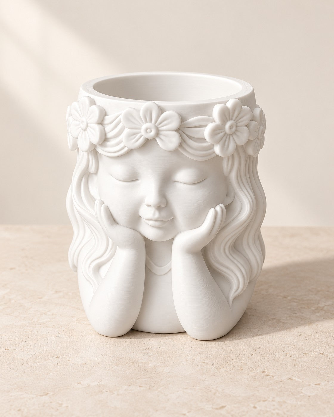 Sculpted Face Vase on a pale limestone plinth, soft studio light
