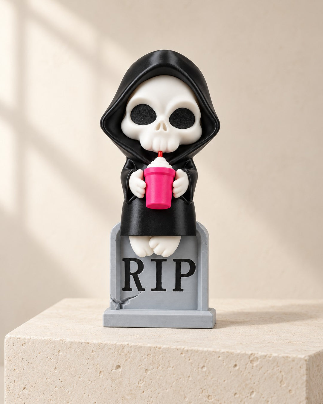 Sweet Rest Reaper: Cute gothic figurine on a RIP tombstone, about 10 cm high