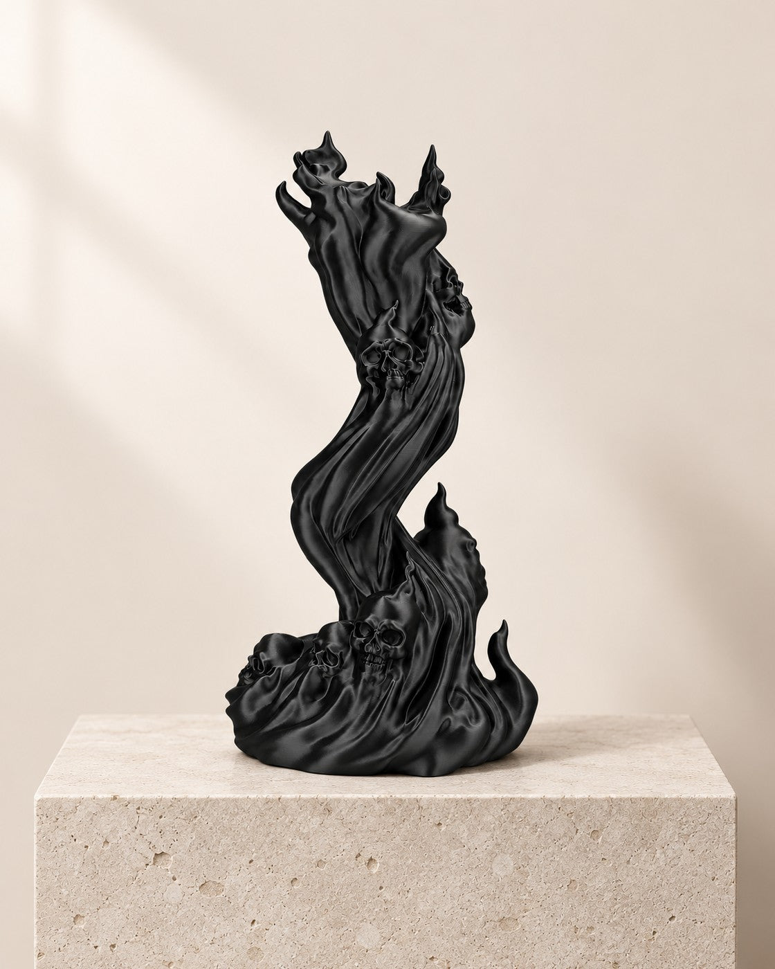 Flaming Skull Headphone Stand on a pale limestone plinth, soft studio light