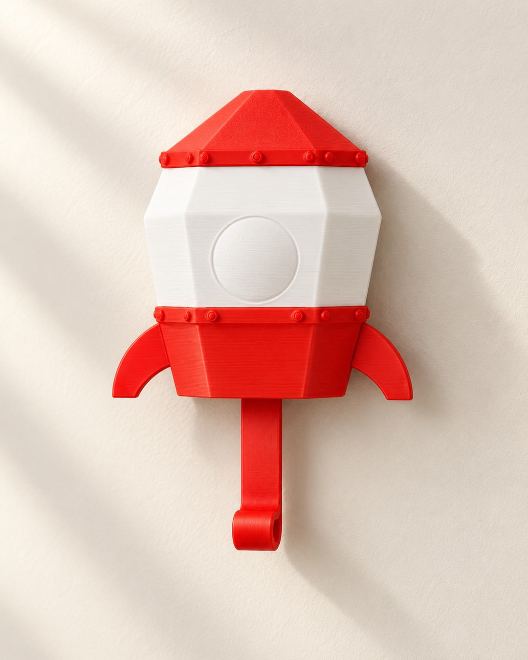 Pop-Up Astronaut Key Holder: A wall hook where a small astronaut rises from a rocket