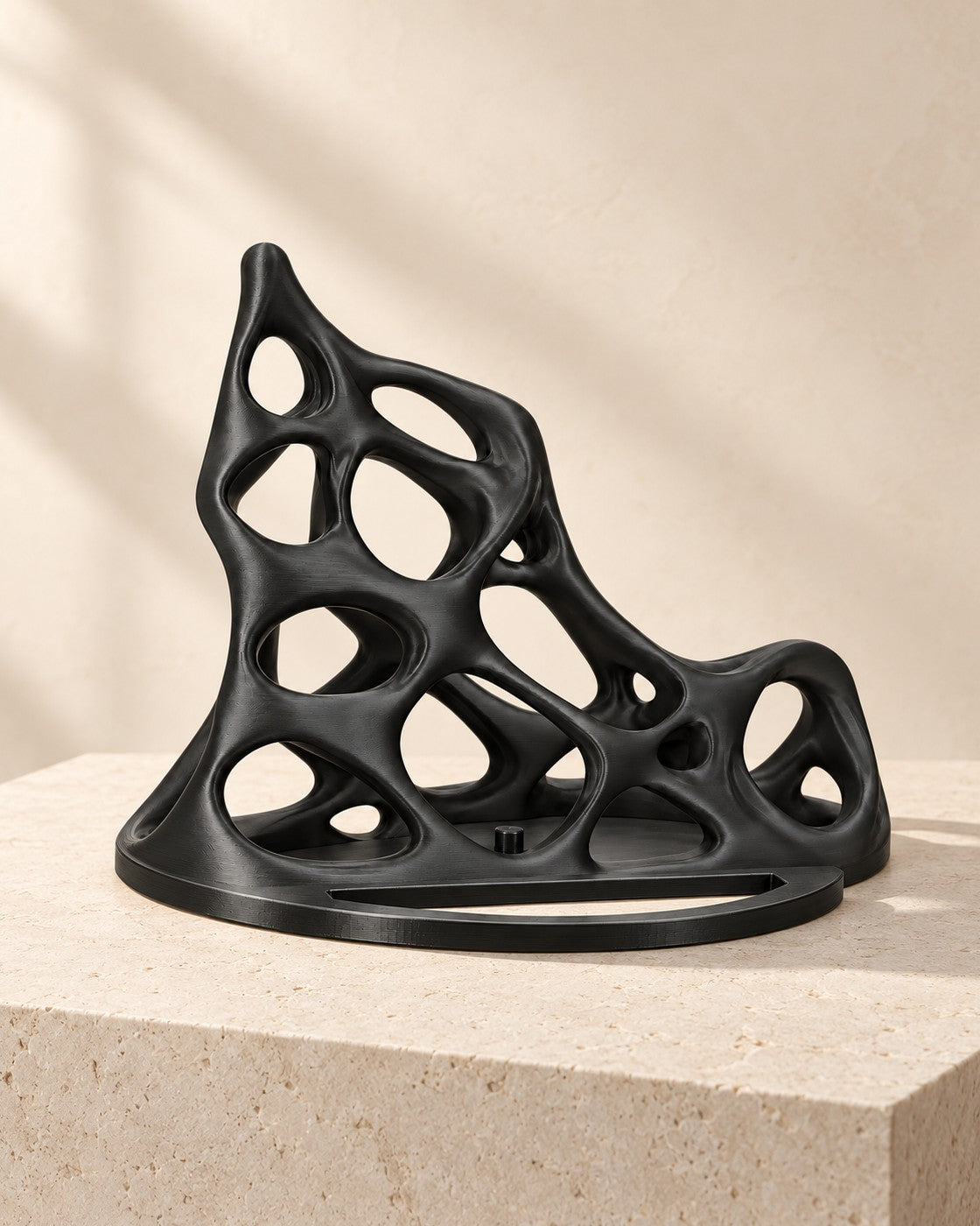 Black Lattice Console Stand on a pale limestone plinth, soft studio light