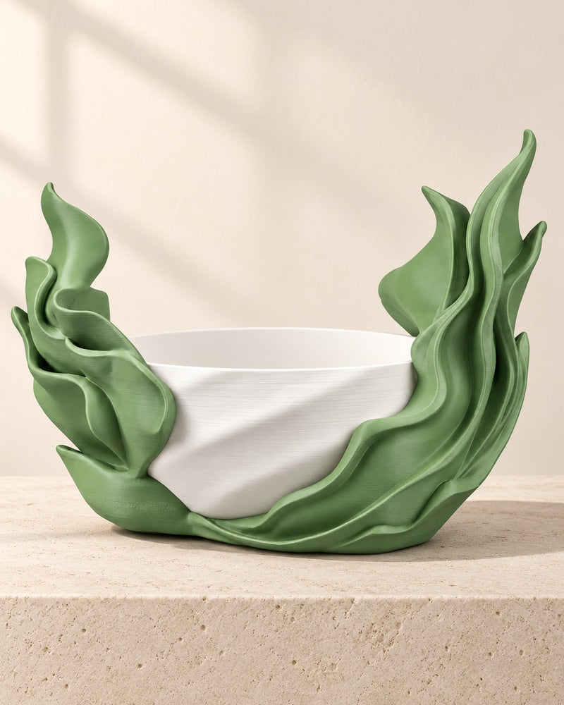 Seaweed Flow Self-Watering Planter on a pale limestone plinth, soft studio light