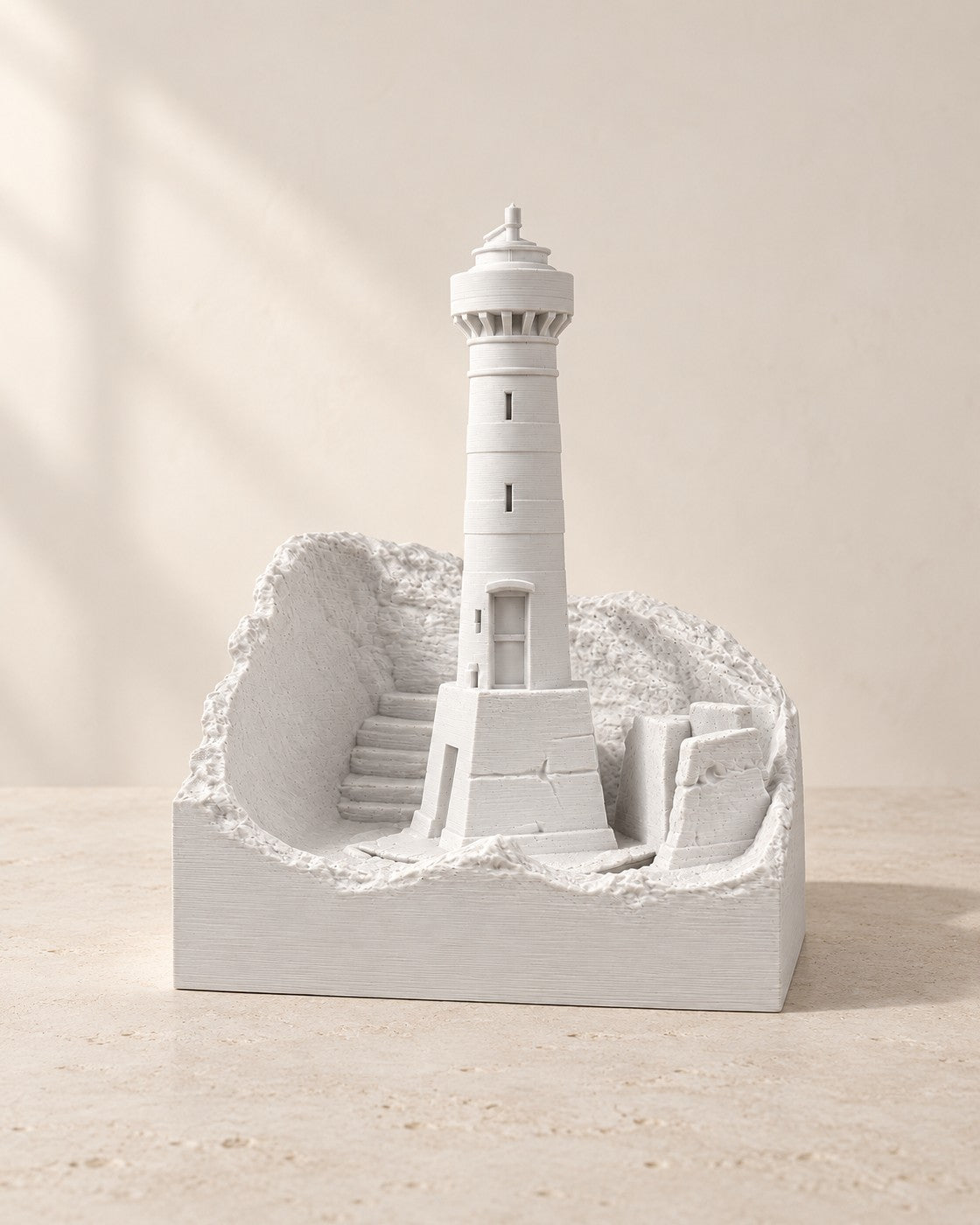 Coastal Lighthouse Lamp on a pale limestone plinth, soft studio light