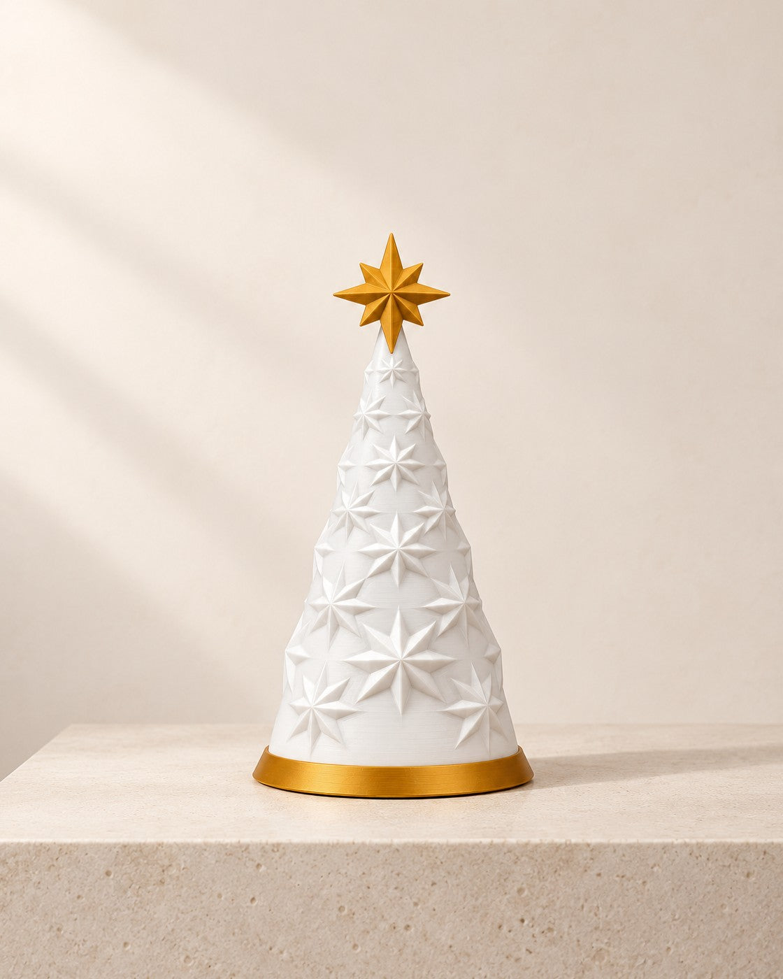 White and Gold Tree Lamp on a pale limestone plinth, soft studio light