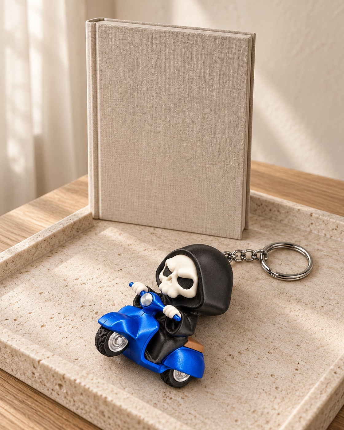 Grim Rider Keyring in a calm, softly lit interior, shown at true scale