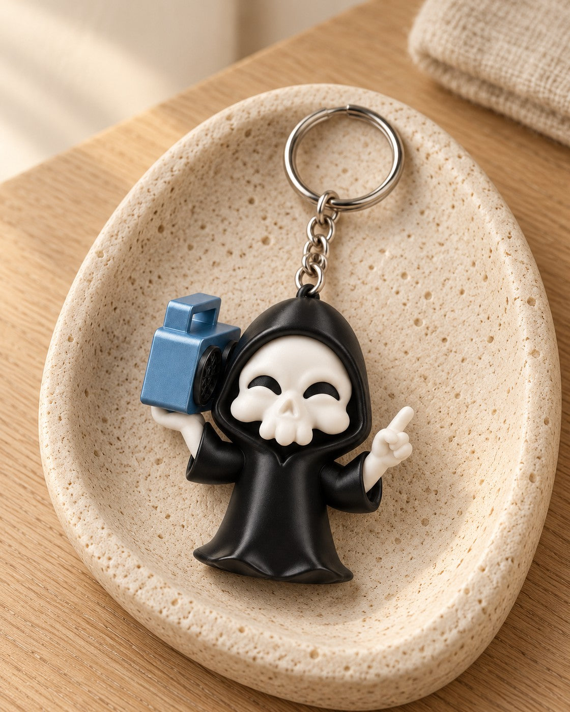 Groove Reaper Keyring in a calm, softly lit interior, shown at true scale