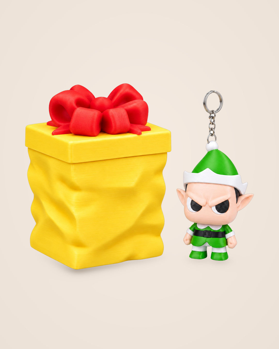 Grumpy Elf with Gift Container: A festive elf keyring with a separate yellow gift container