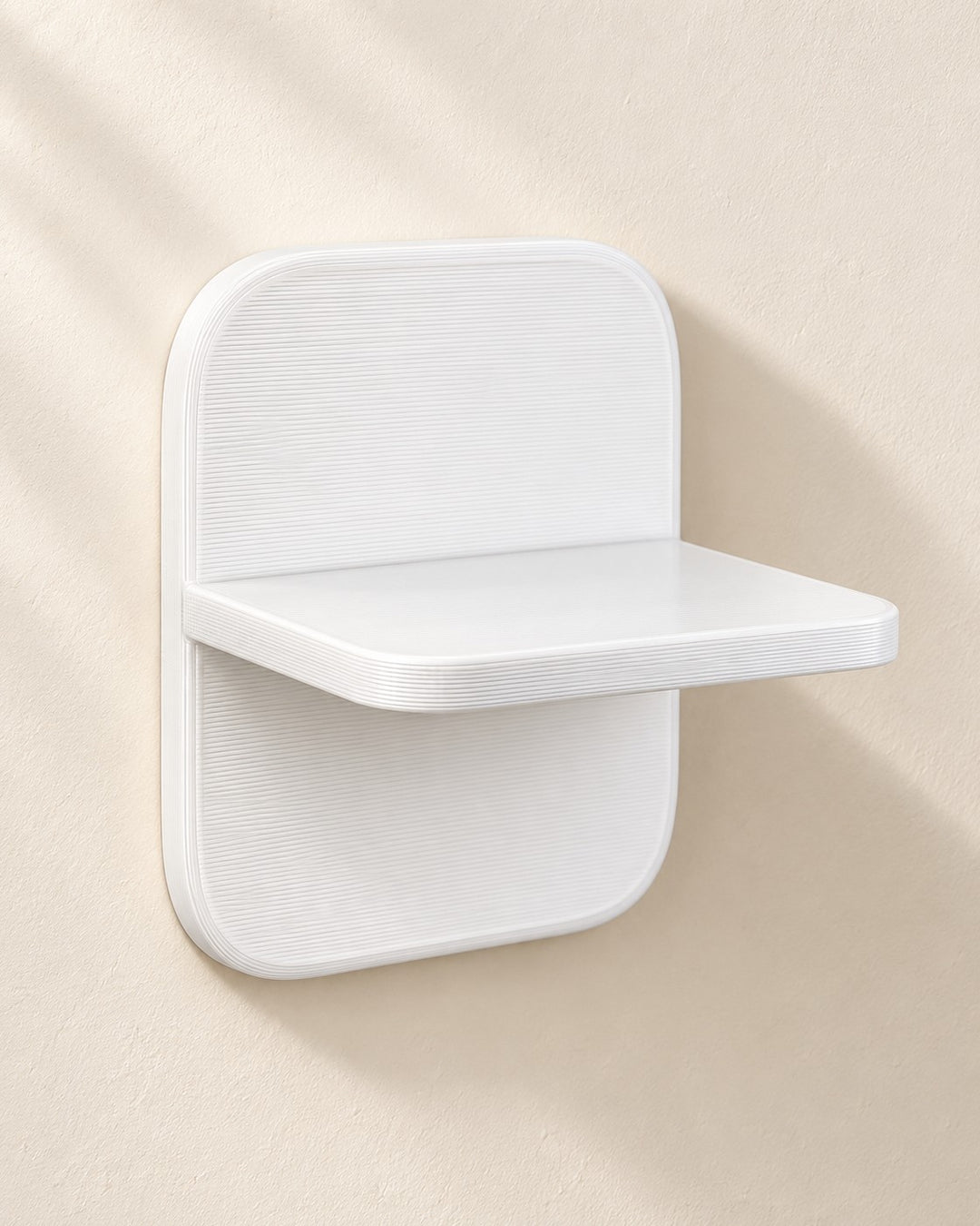 Small Floating Shelf: One-piece wall ledge with a softly rounded backplate, in white PETG