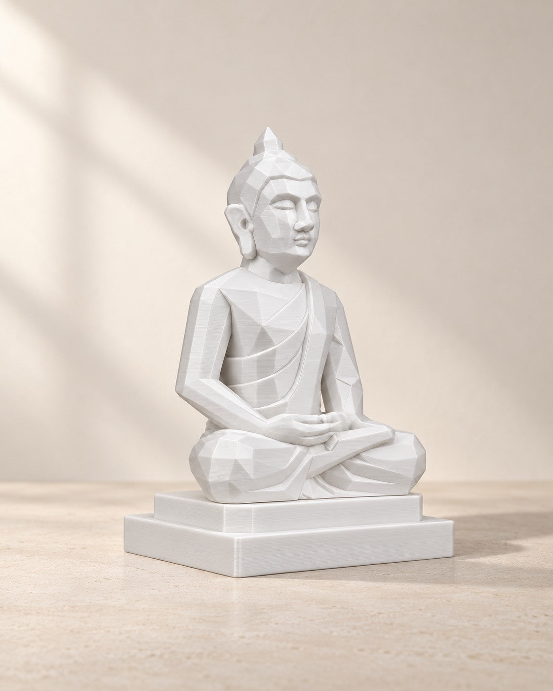 Small Meditating Buddha on a pale limestone plinth, soft studio light