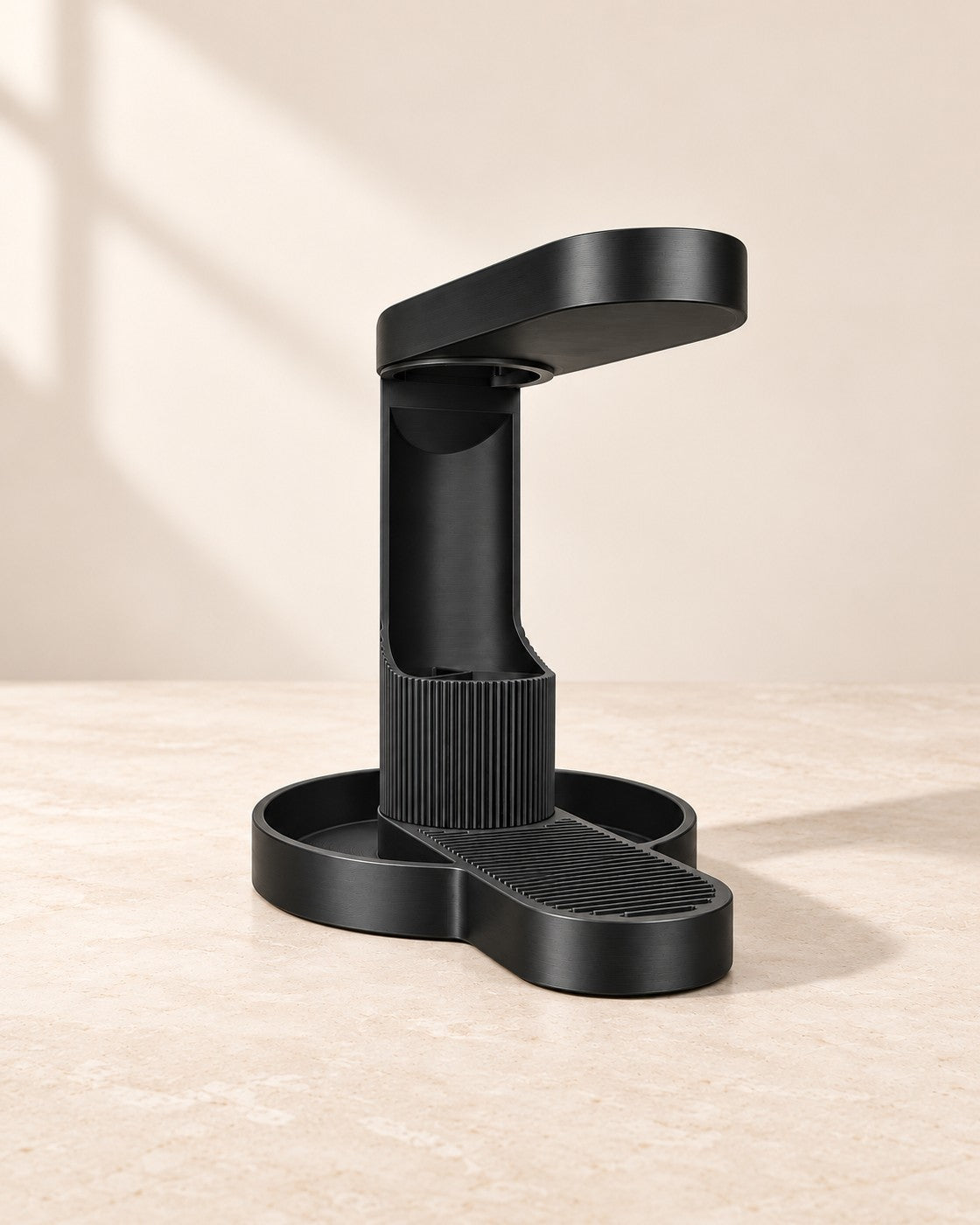 Tower Headphone Stand on a pale limestone plinth, soft studio light