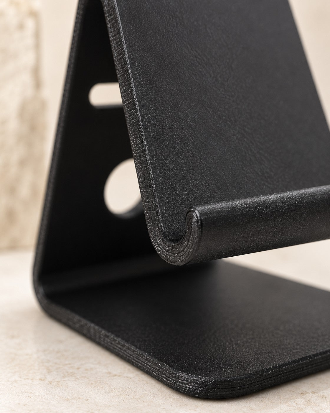 Close-up of the Black Desktop Phone Stand showing fine printed layer lines