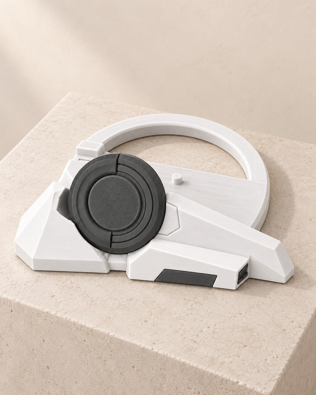 Sci-Fi Console Stand: Faceted white stand with a charcoal disc for slim games consoles
