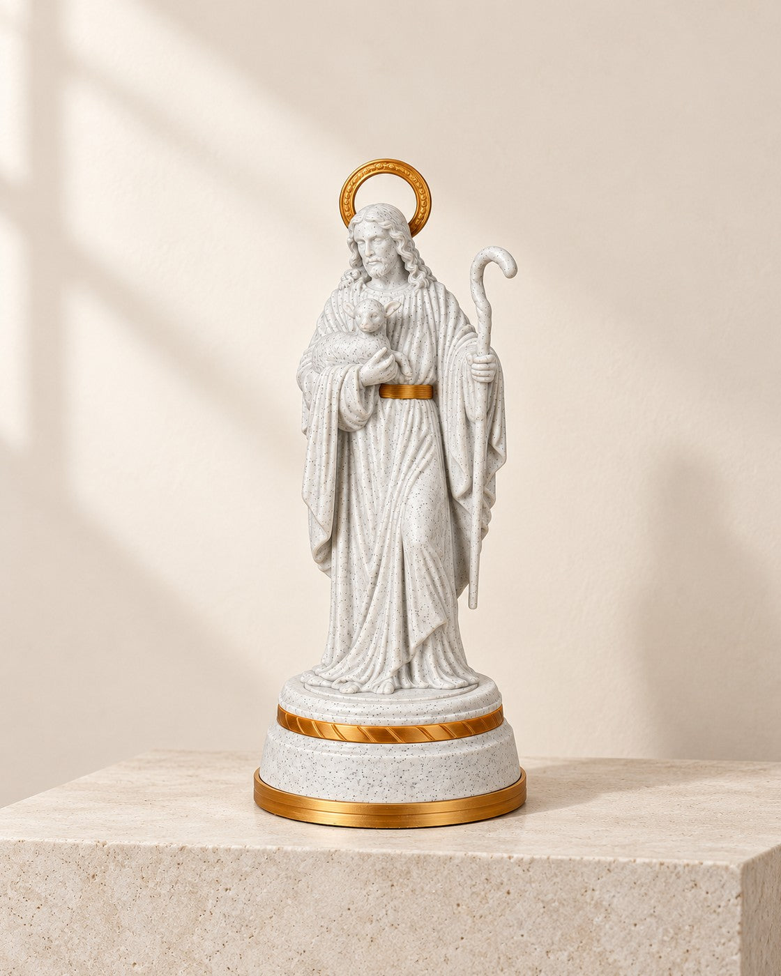 Good Shepherd Statue on a pale limestone plinth, soft studio light