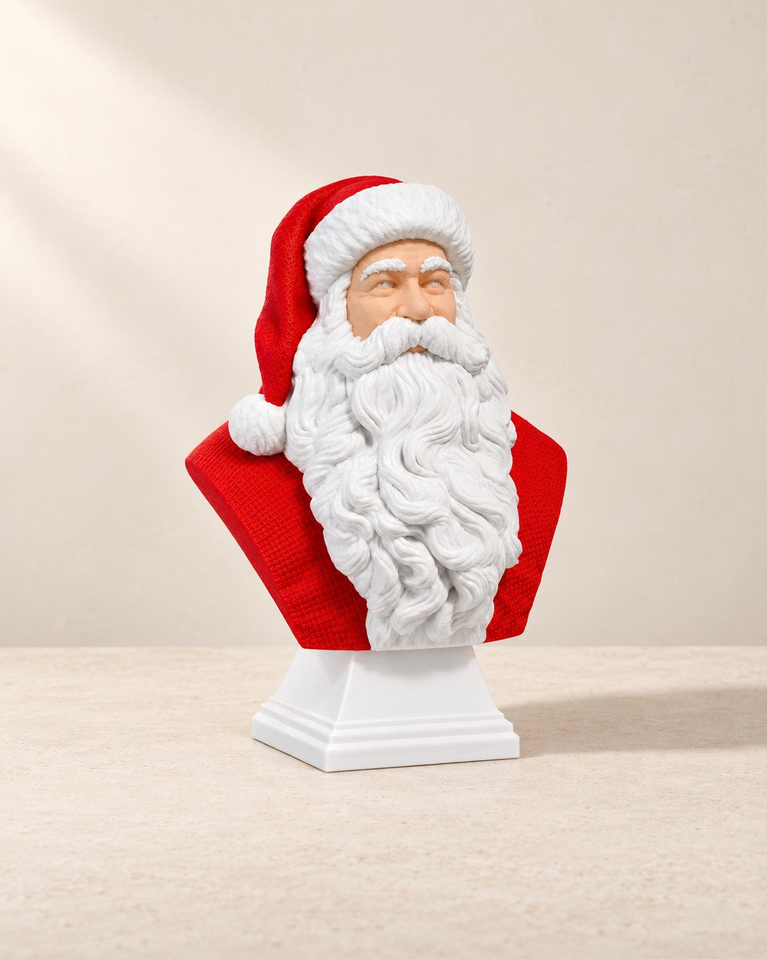 Father Christmas Bust on a pale limestone plinth, soft studio light