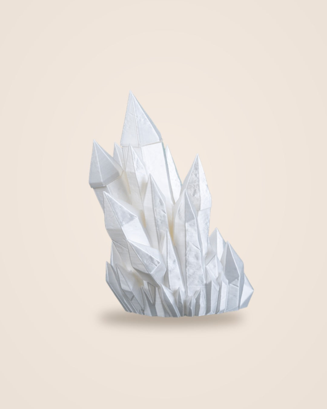 White crystal cluster bookend, front view, on a soft cream background