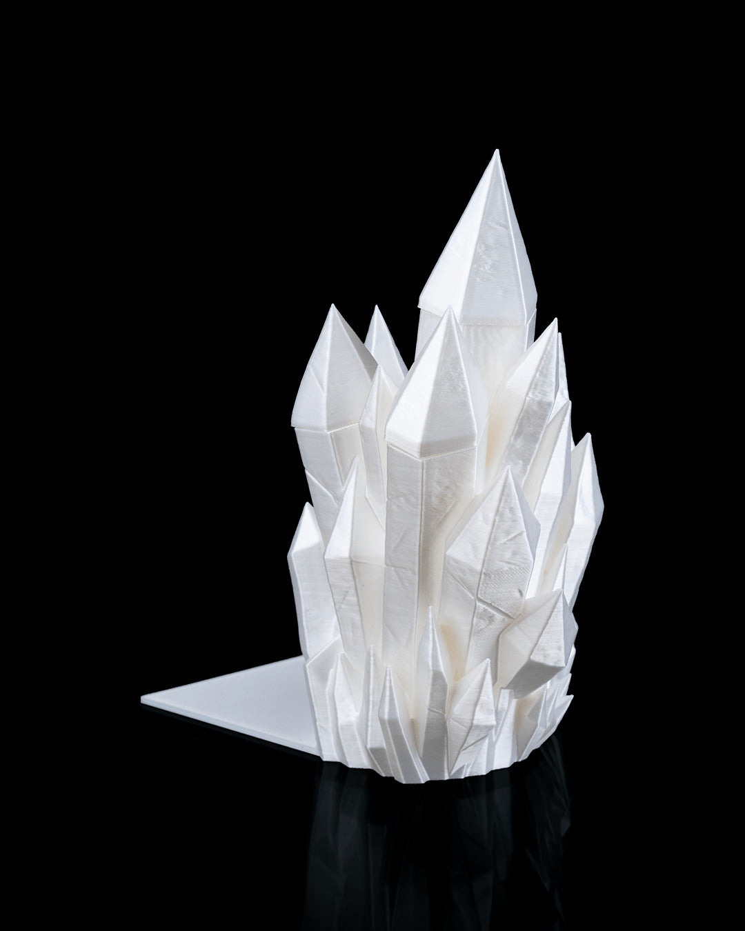 White crystal cluster bookend with its flat base plate, three-quarter studio view