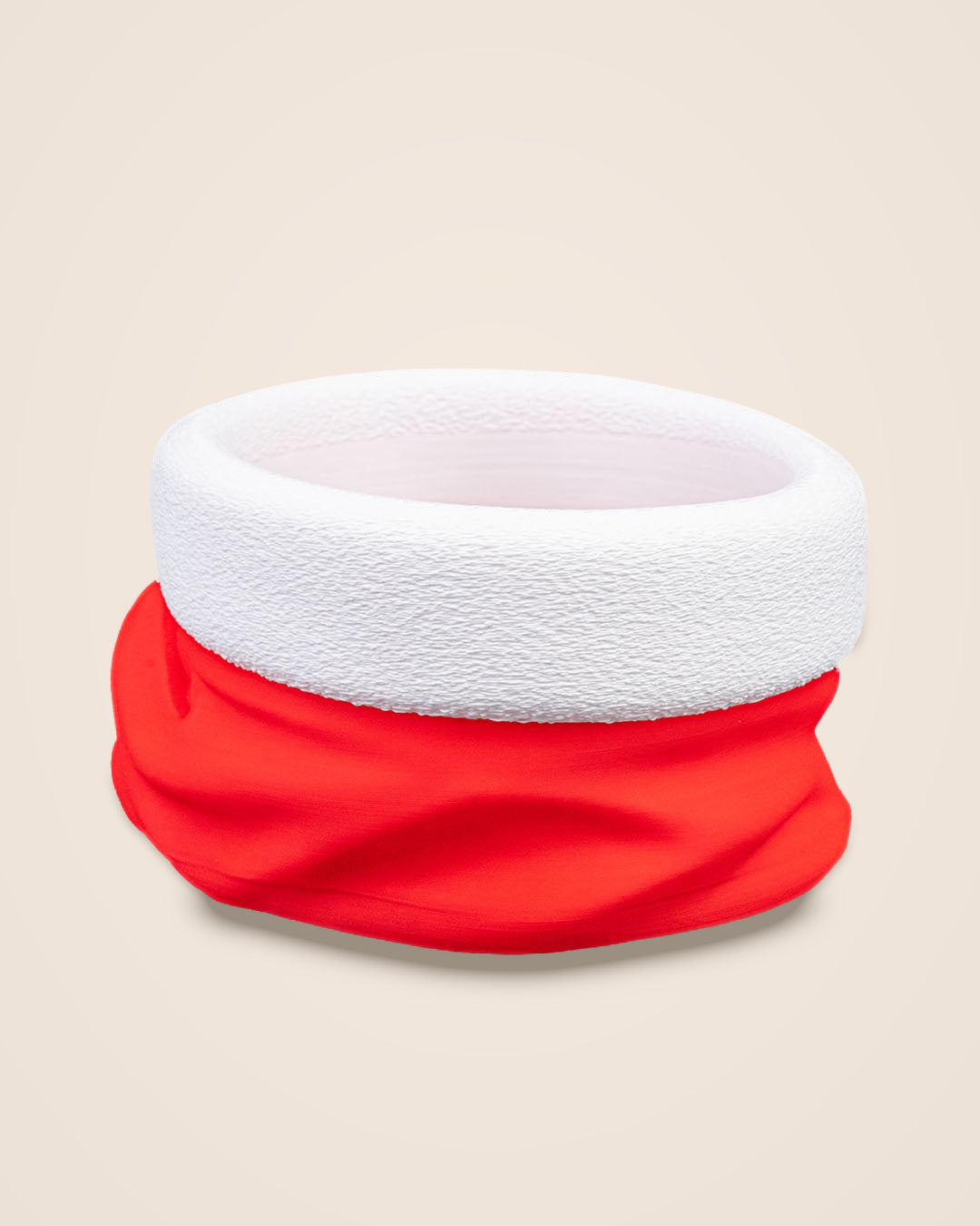 Front view of an empty red Santa hat bowl with a textured white rim and gathered red body on a cream background
